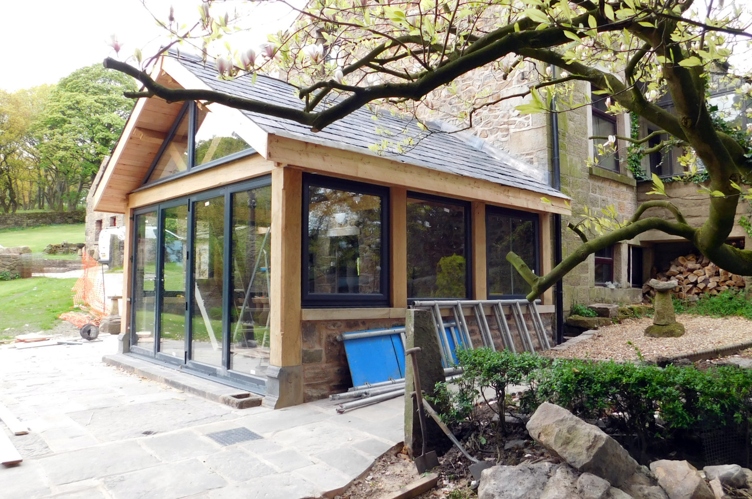 Extension with traditional Oak Frame, stone walls and slate roof
