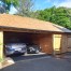 Twin Carport and Garage with hand crafted oak doors, oak frame, cedar roof shingles, Holmfirth